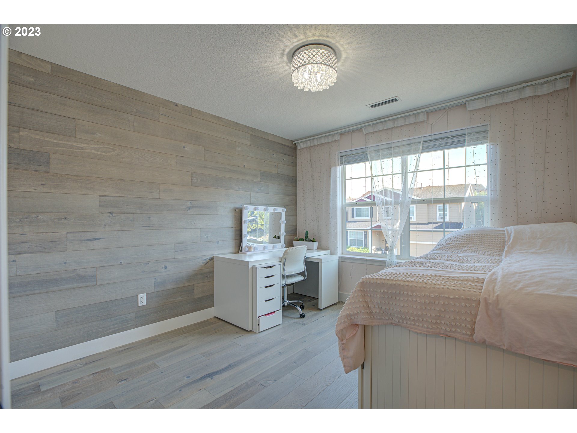 6055 Southeast 28th Street Gresham, OR 97080 - Photo 44 of 48 a bedroom with a bed and wooden floor