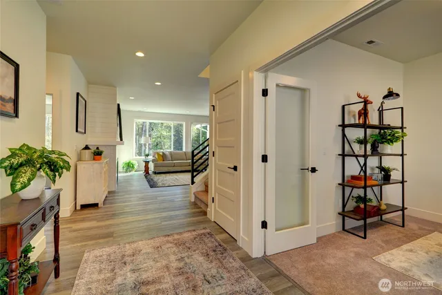 a living room with furniture and a rug