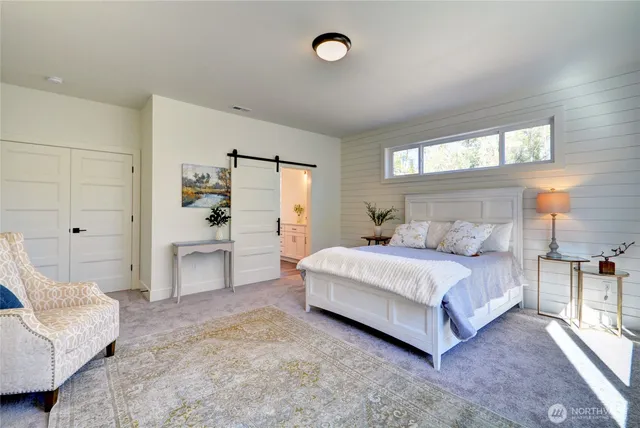 a bedroom with a bed and a couch