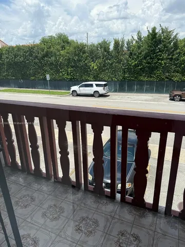 a view of a balcony with car