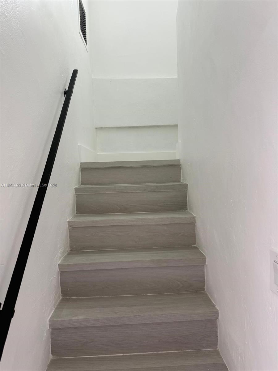 1000 West 28th Street, Unit 16 Hialeah, FL 33010 - Photo 6 of 13 a view of staircase with white walls