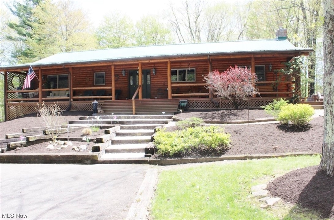 17367 Reeves Road Middlefield, OH 44062 - Photo 1 of 35 View of log-style house