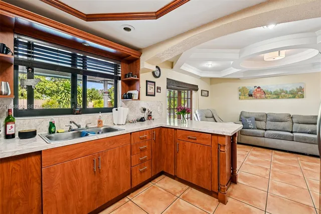 a kitchen with stainless steel appliances granite countertop a sink and cabinets