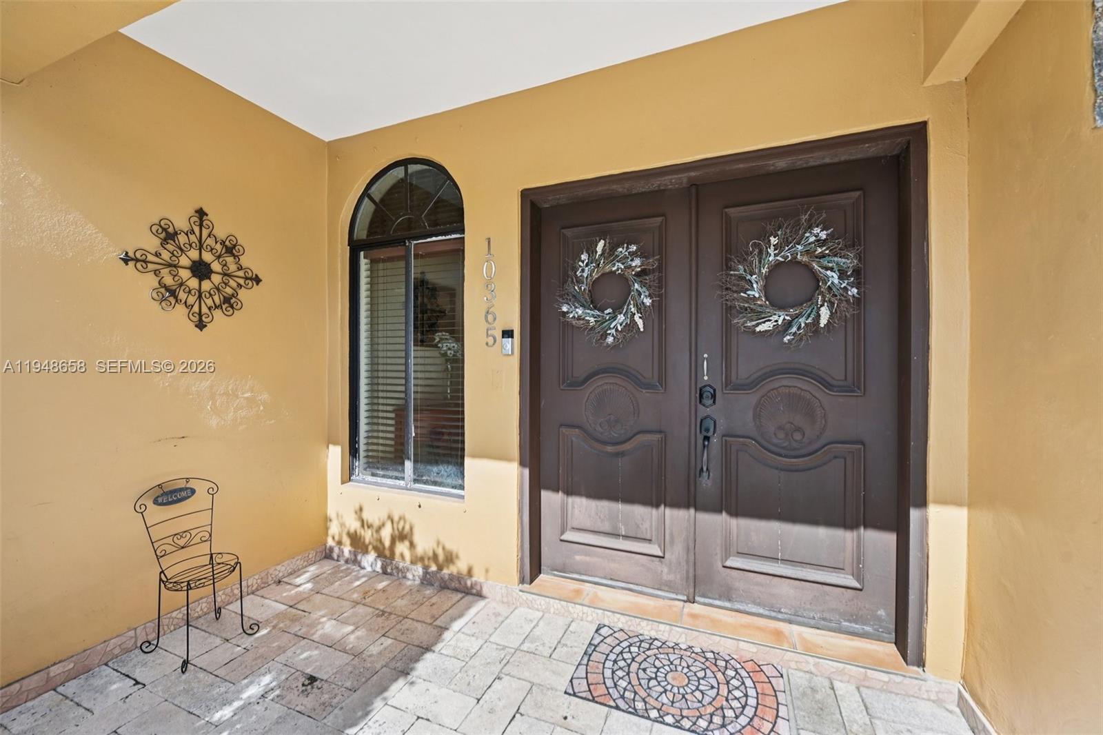 10365 Southwest 11th Terrace, Unit 49B Miami, FL 33174 - Photo 2 of 36 a view of a entryway door of the house