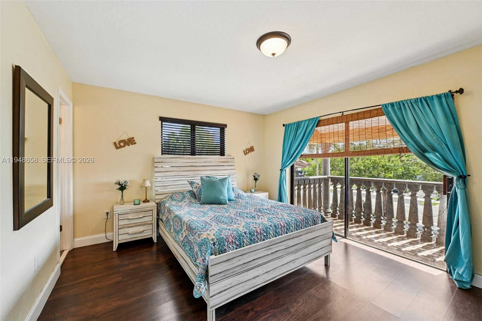 10365 Southwest 11th Terrace, Unit 49B Miami, FL 33174 - Photo 26 of 36 a bedroom with a bed and a window