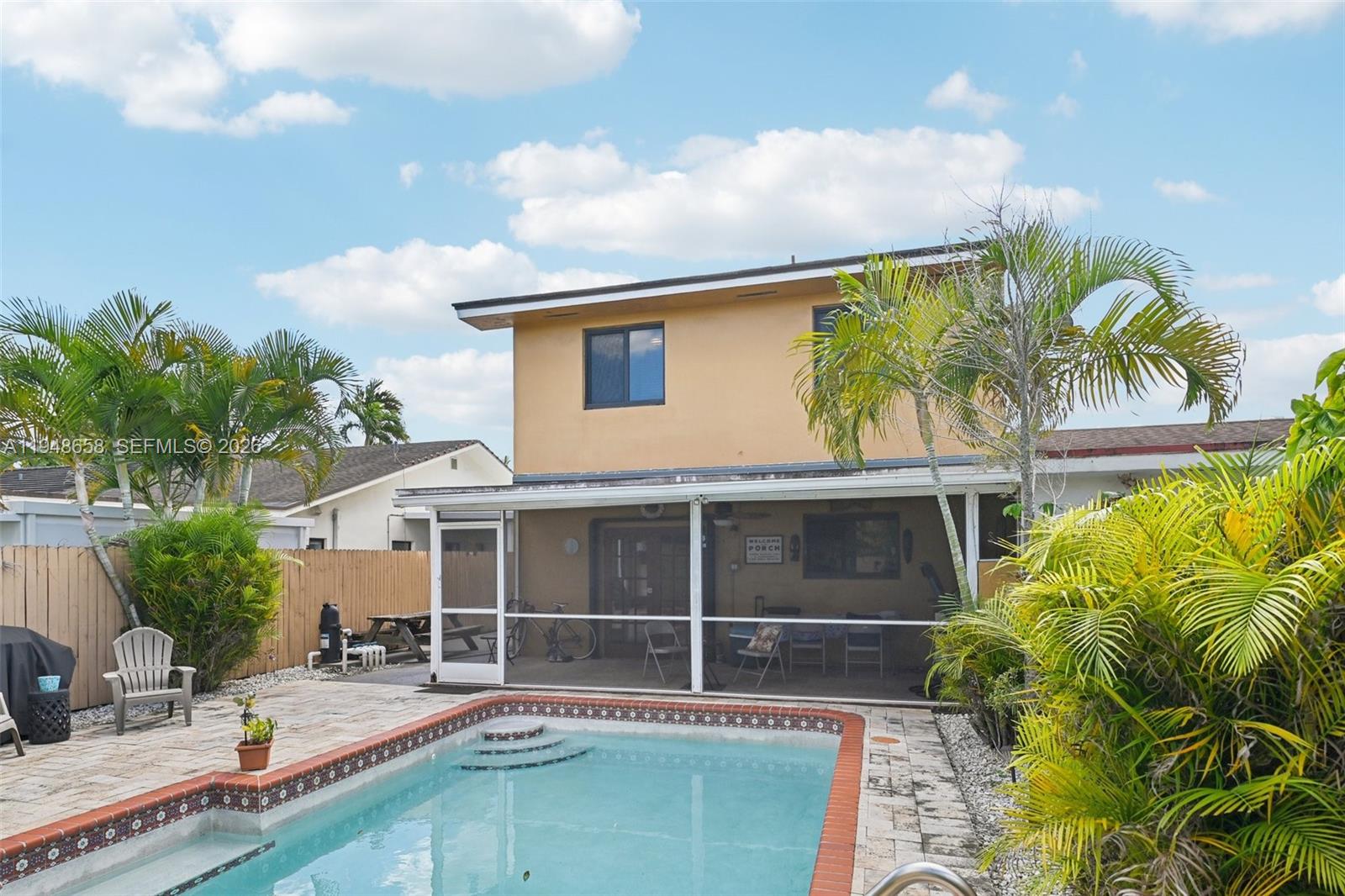 10365 Southwest 11th Terrace, Unit 49B Miami, FL 33174 - Photo 35 of 36 a house with palm tree in front of it