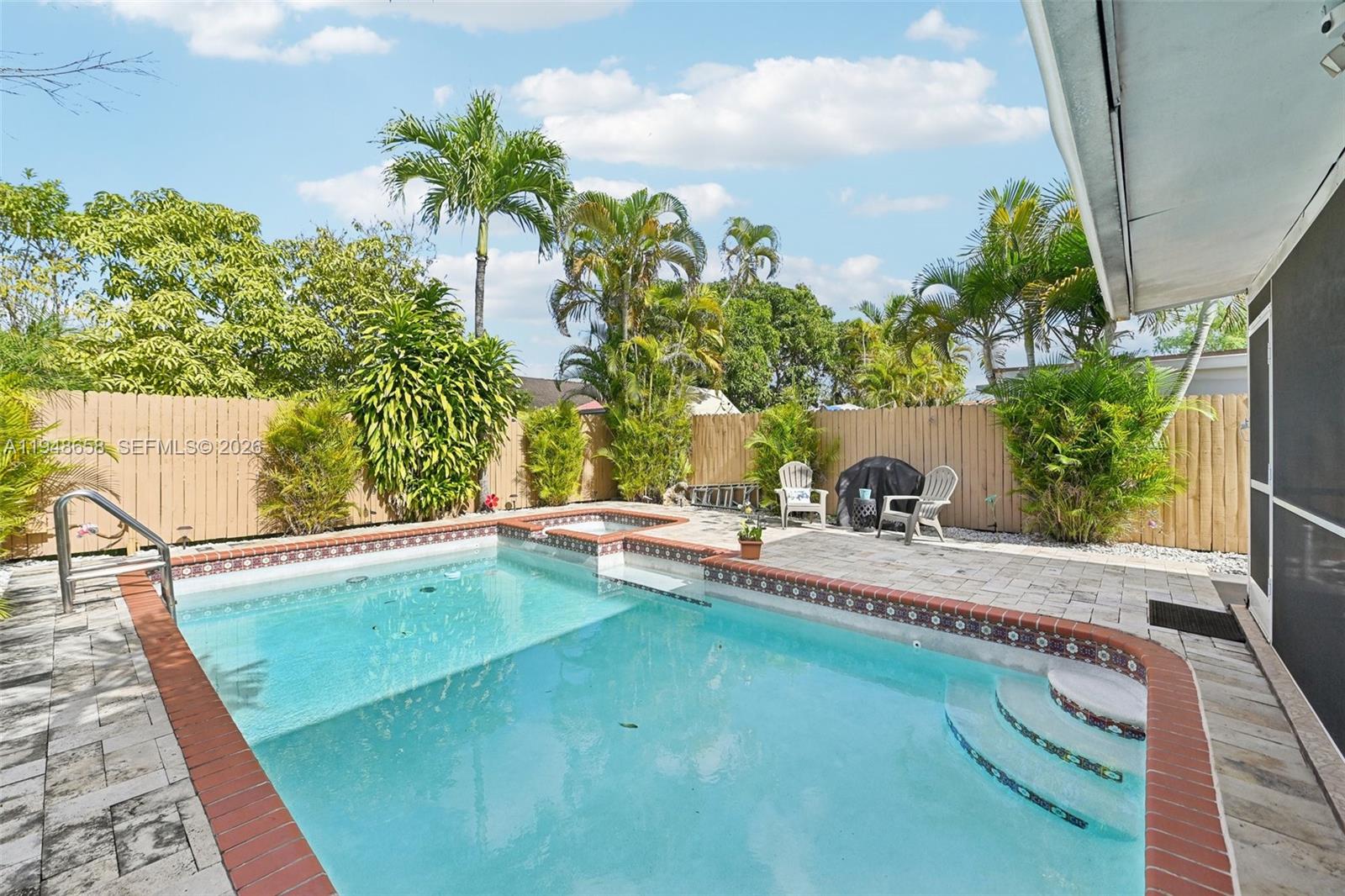 10365 Southwest 11th Terrace, Unit 49B Miami, FL 33174 - Photo 36 of 36 a view of a backyard with plants and a patio