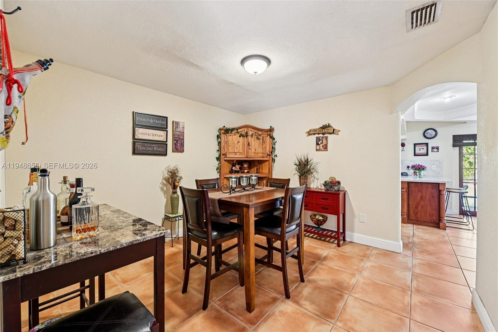 10365 Southwest 11th Terrace, Unit 49B Miami, FL 33174 - Photo 7 of 36 a view of a dining room with furniture