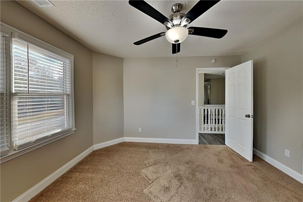 5305 Rutland Court Powder Springs, GA 30127 - Photo 16 of 22 en view interior of a room with a ceiling fan and window