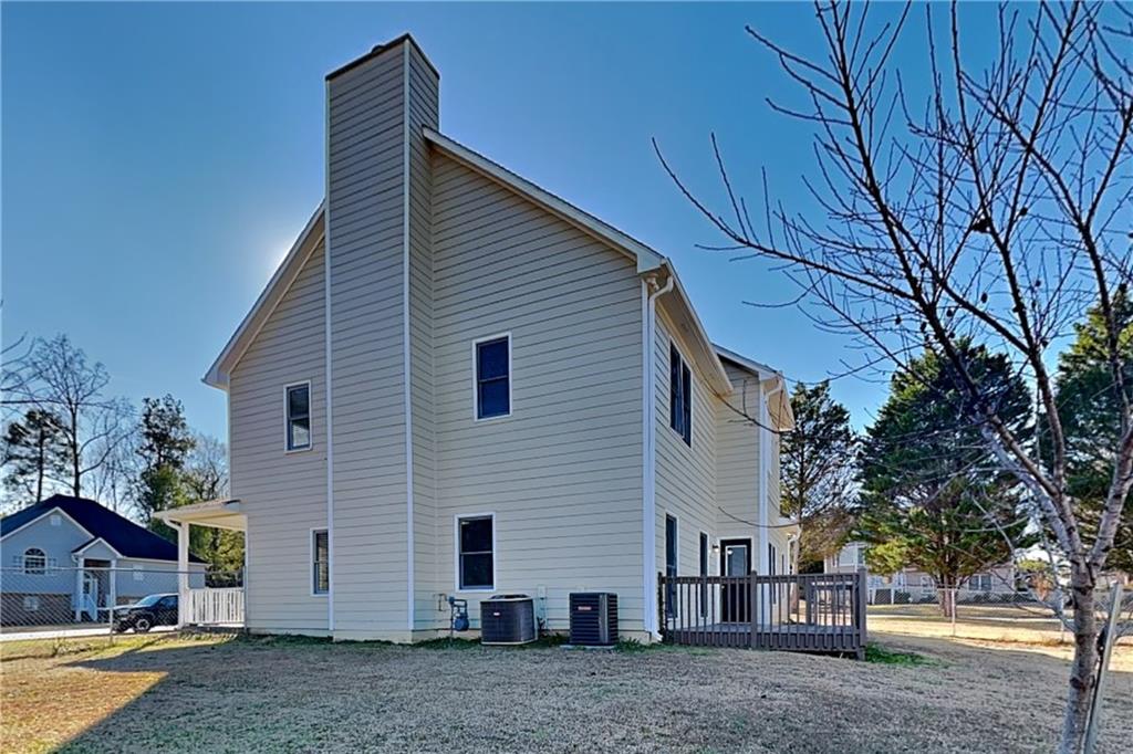 5305 Rutland Court Powder Springs, GA 30127 - Photo 19 of 22 a view of a house with a yard