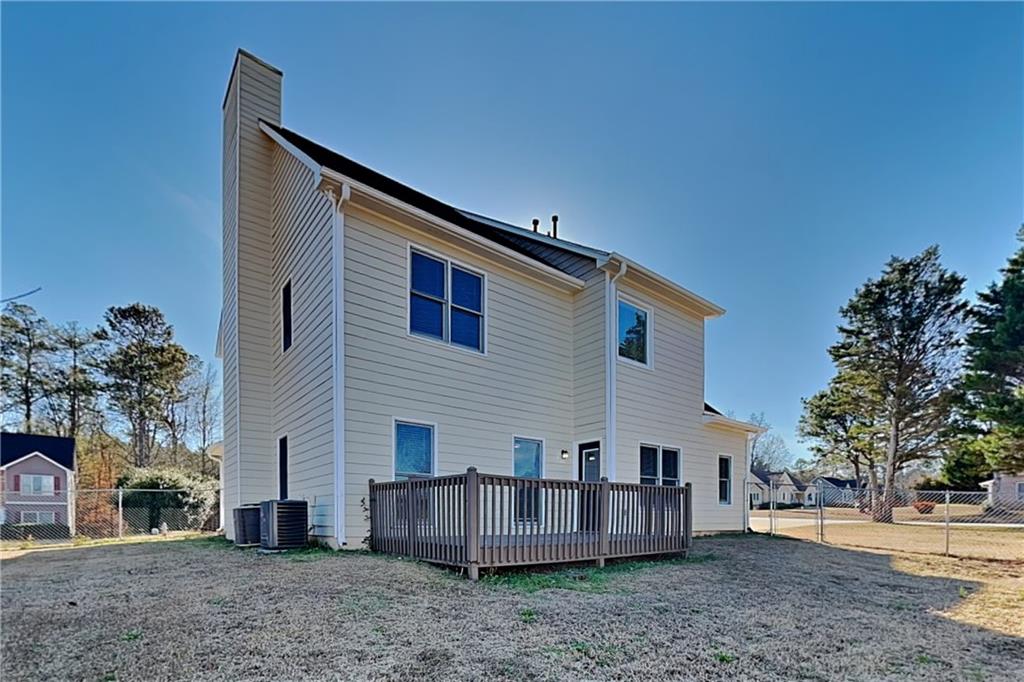 5305 Rutland Court Powder Springs, GA 30127 - Photo 20 of 22 a view of a house with a backyard and a tree