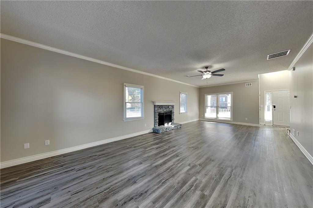 5305 Rutland Court Powder Springs, GA 30127 - Photo 2 of 22 wooden floor in an empty room with a window