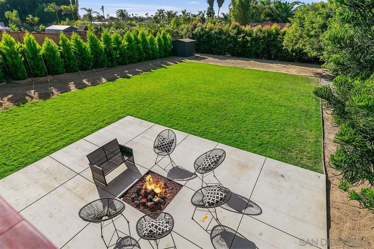 970 Saxony Road Encinitas, CA 92024 - Photo 2 of 39 a view of a table and chairs in backyard