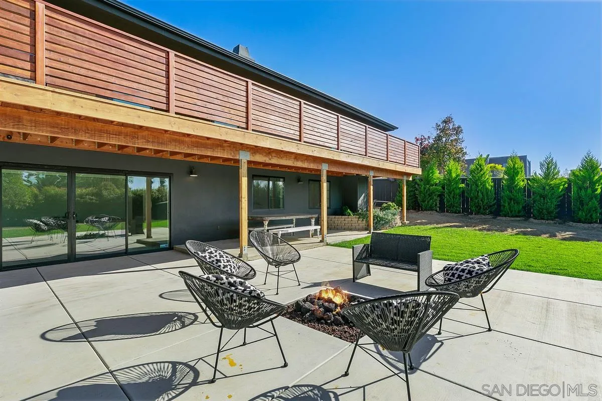970 Saxony Road Encinitas, CA 92024 - Photo 25 of 39 a view of a patio with couple of chairs and a yard
