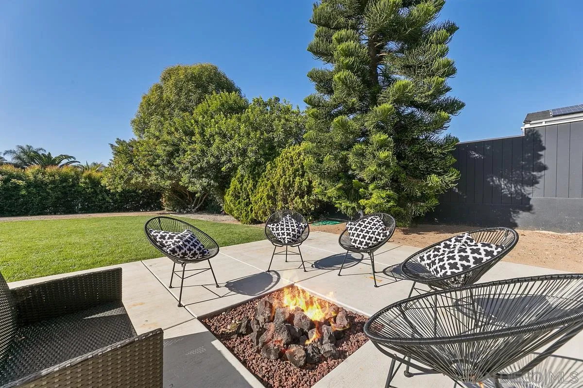 970 Saxony Road Encinitas, CA 92024 - Photo 26 of 39 a view of a chairs and table in patio