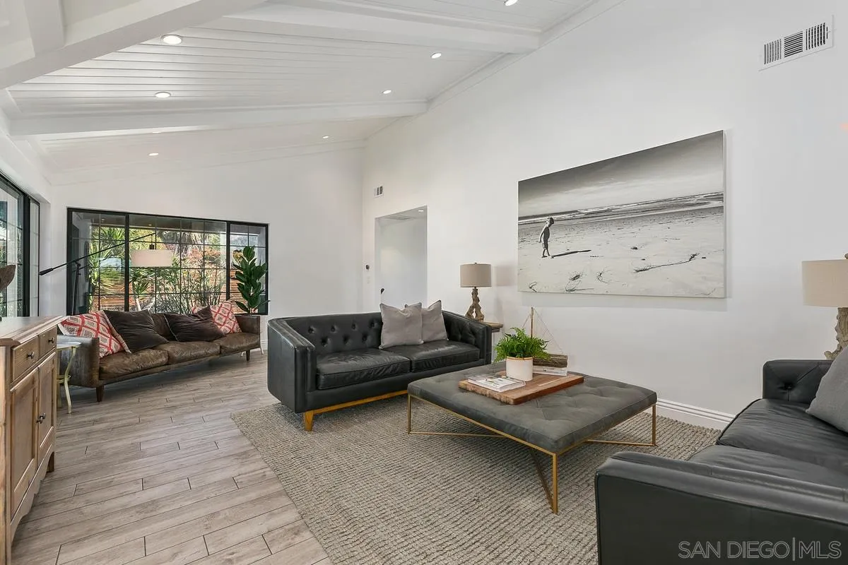970 Saxony Road Encinitas, CA 92024 - Photo 30 of 39 a living room with furniture and wooden floor