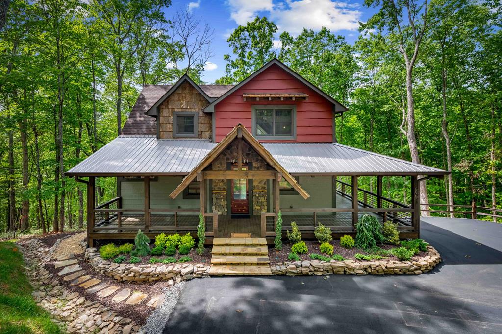 895 Price Road Blue Ridge, GA 30513 - Photo 19 of 140 a front view of a house with a garden