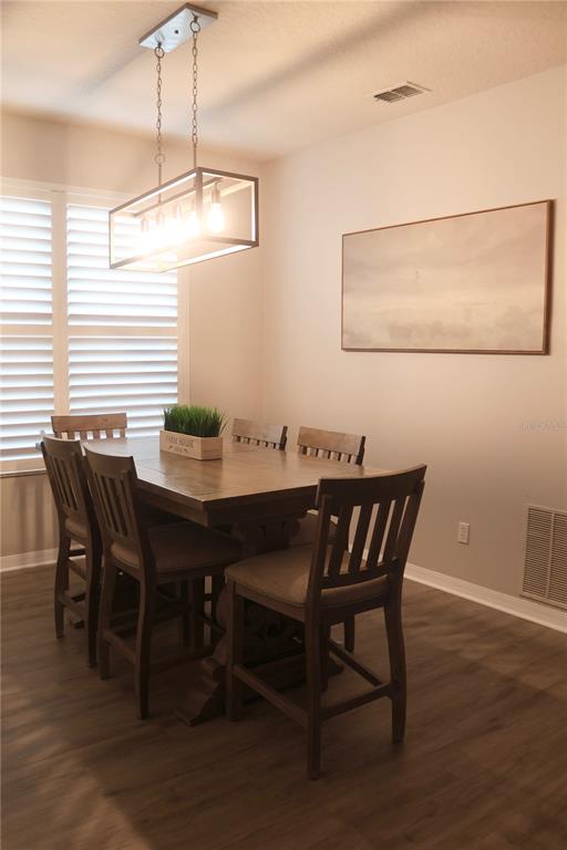 3850 Beacon Ridge Way Clermont, FL 34711 - Photo 37 of 41 a view of a dining room with furniture