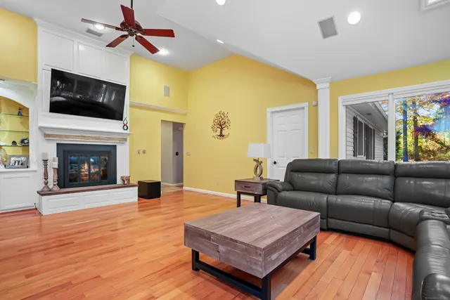 a living room with furniture and a fireplace