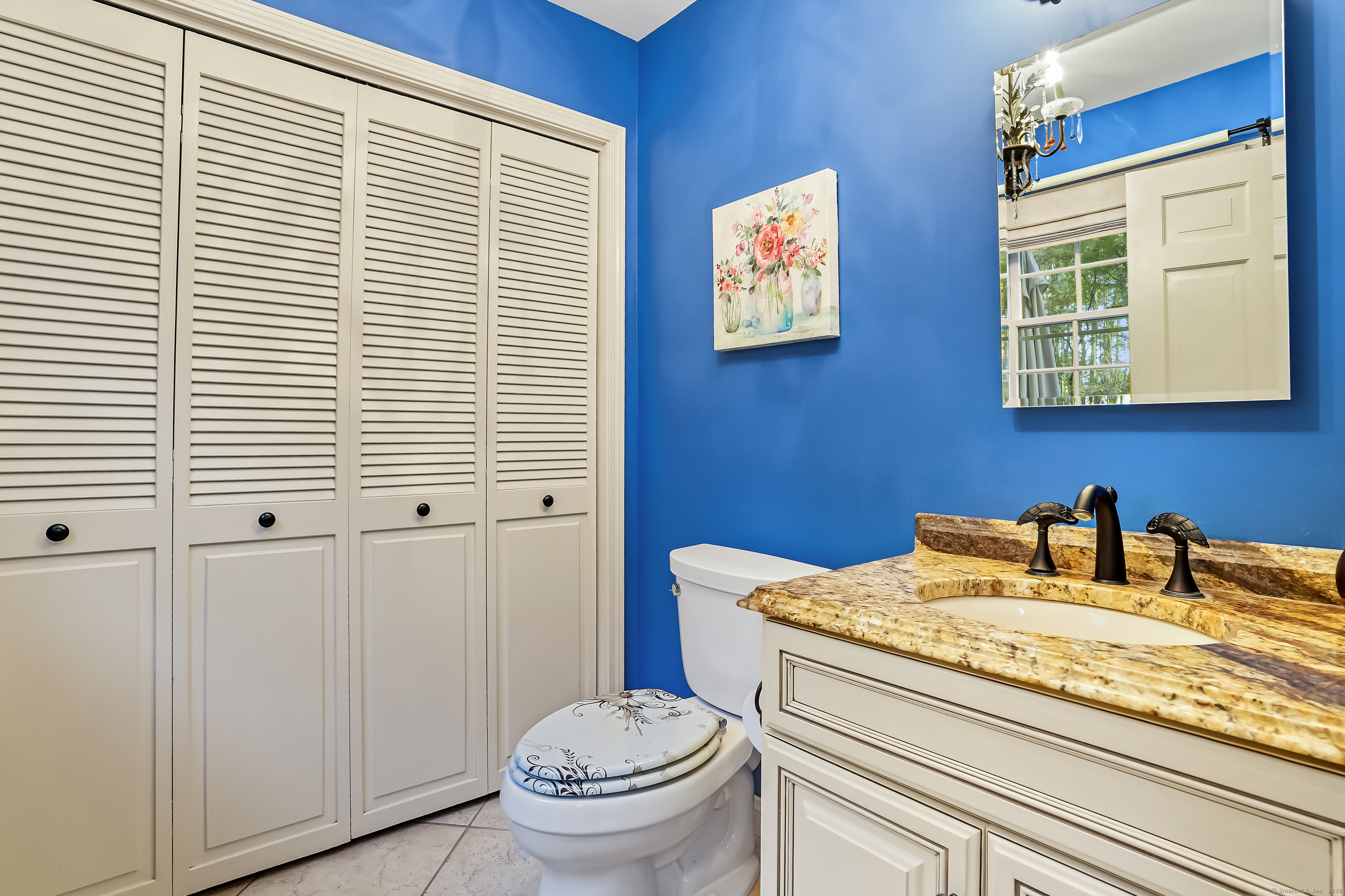 4 Autumn Ridge Road New Fairfield, CT 06812 - Photo 16 of 40 a bathroom with a toilet a sink and mirror