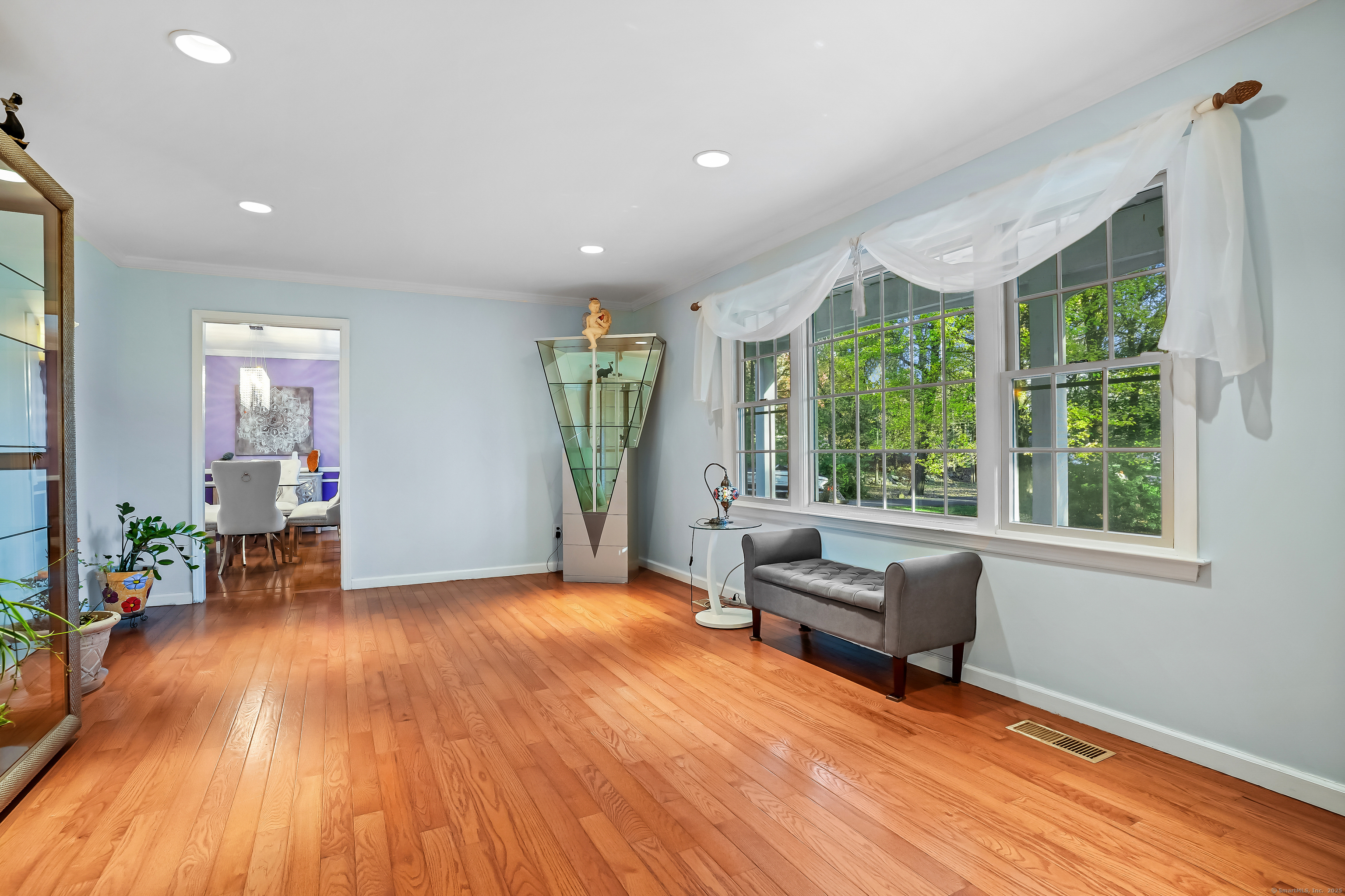 4 Autumn Ridge Road New Fairfield, CT 06812 - Photo 19 of 40 a living room with furniture and a wooden floor