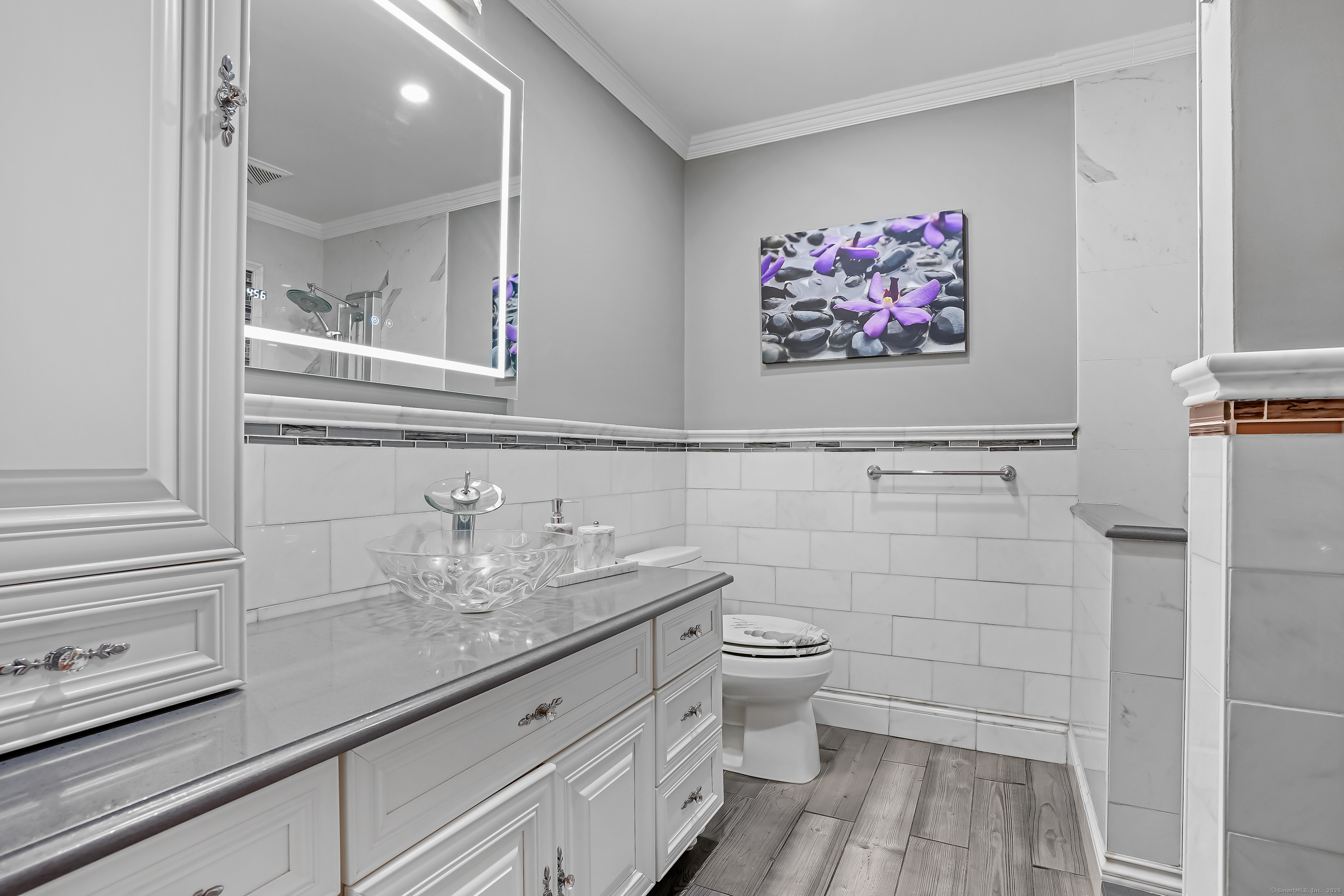4 Autumn Ridge Road New Fairfield, CT 06812 - Photo 21 of 40 a bathroom with a granite countertop sink a toilet and a mirror