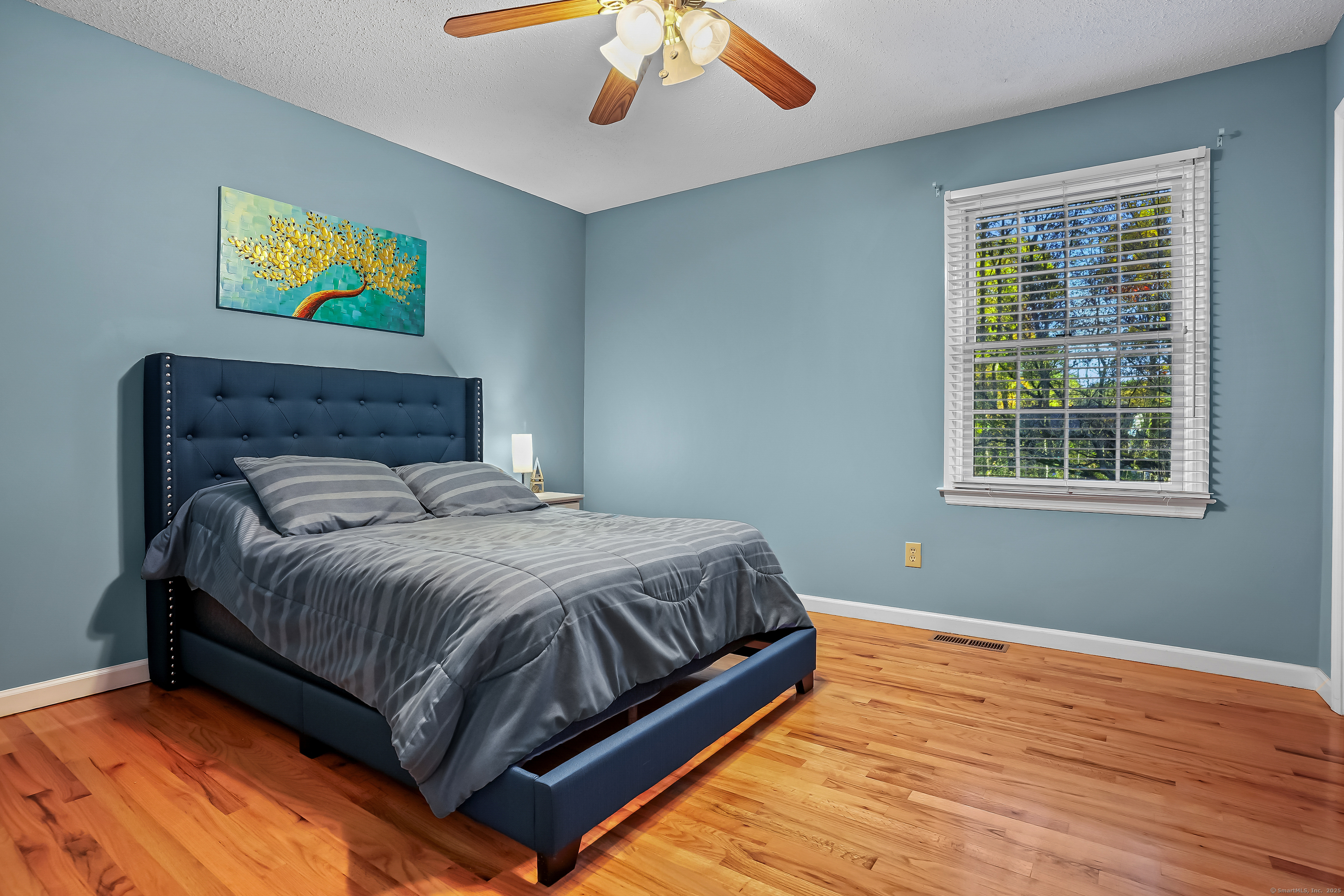 4 Autumn Ridge Road New Fairfield, CT 06812 - Photo 23 of 40 a bed sitting in a bedroom next to a window