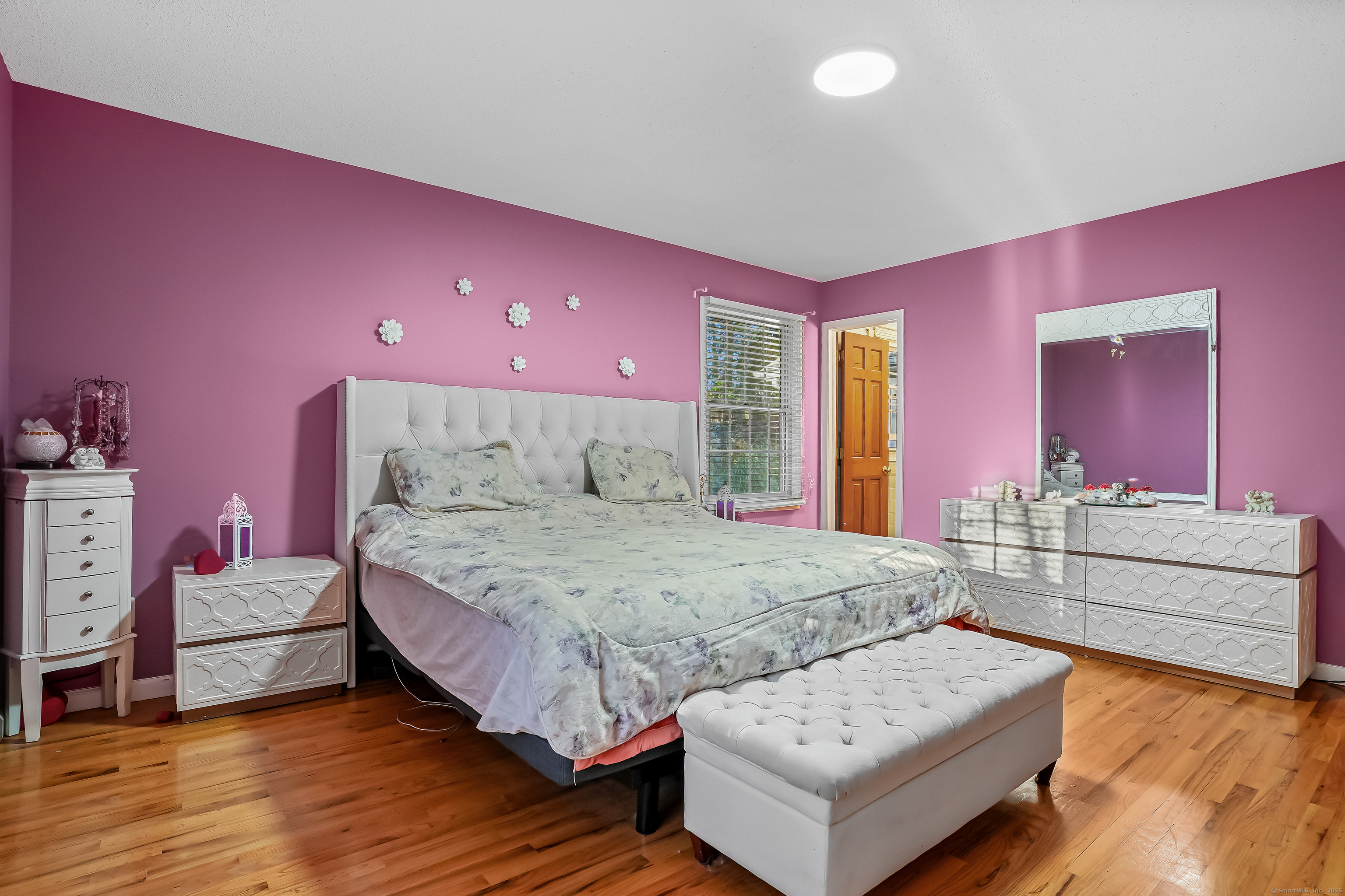 4 Autumn Ridge Road New Fairfield, CT 06812 - Photo 26 of 40 a spacious bedroom with a bed and a couch