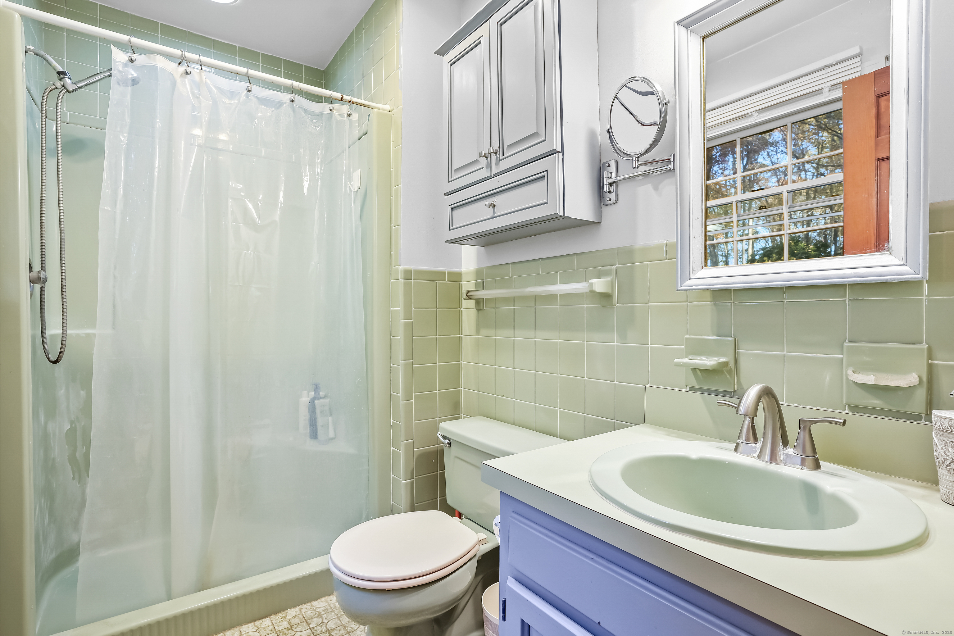4 Autumn Ridge Road New Fairfield, CT 06812 - Photo 27 of 40 a bathroom with a toilet a sink and a shower