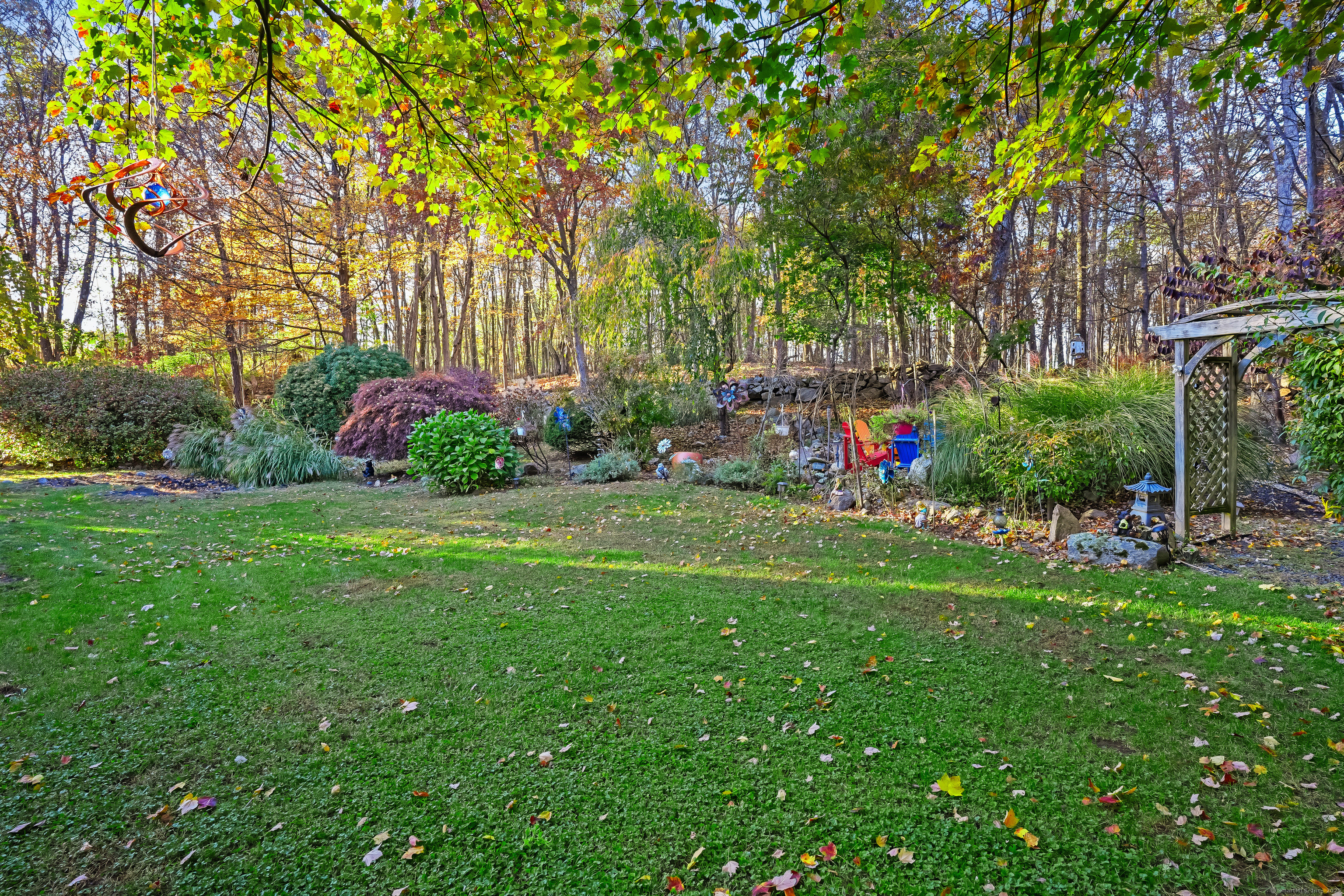 4 Autumn Ridge Road New Fairfield, CT 06812 - Photo 36 of 40 a view of a garden with flowers and trees