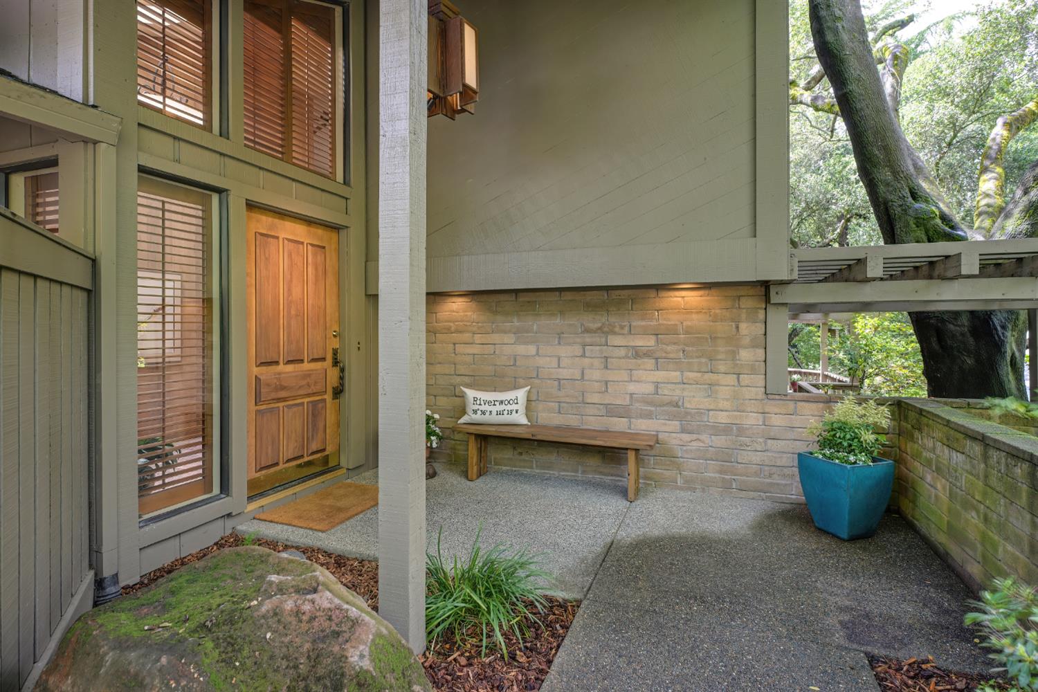 18 Covered Bridge Road Carmichael, CA 95608 - Photo 3 of 81 a view of a patio with table and chairs potted plants