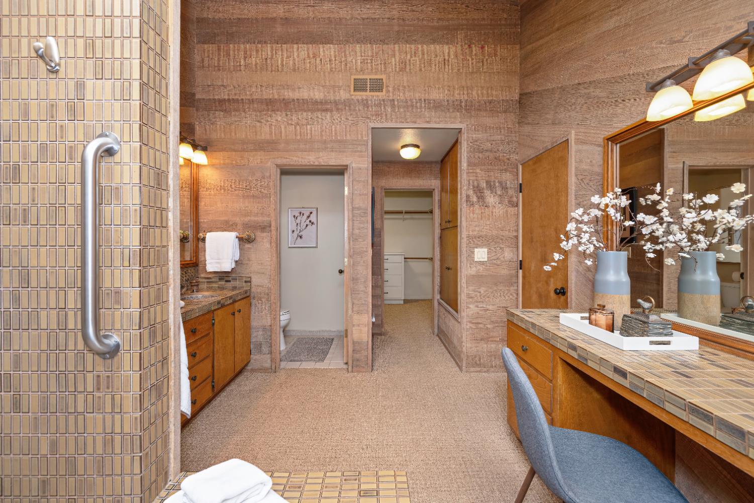 18 Covered Bridge Road Carmichael, CA 95608 - Photo 49 of 81 a bathroom with a double vanity sink a toilet and shower