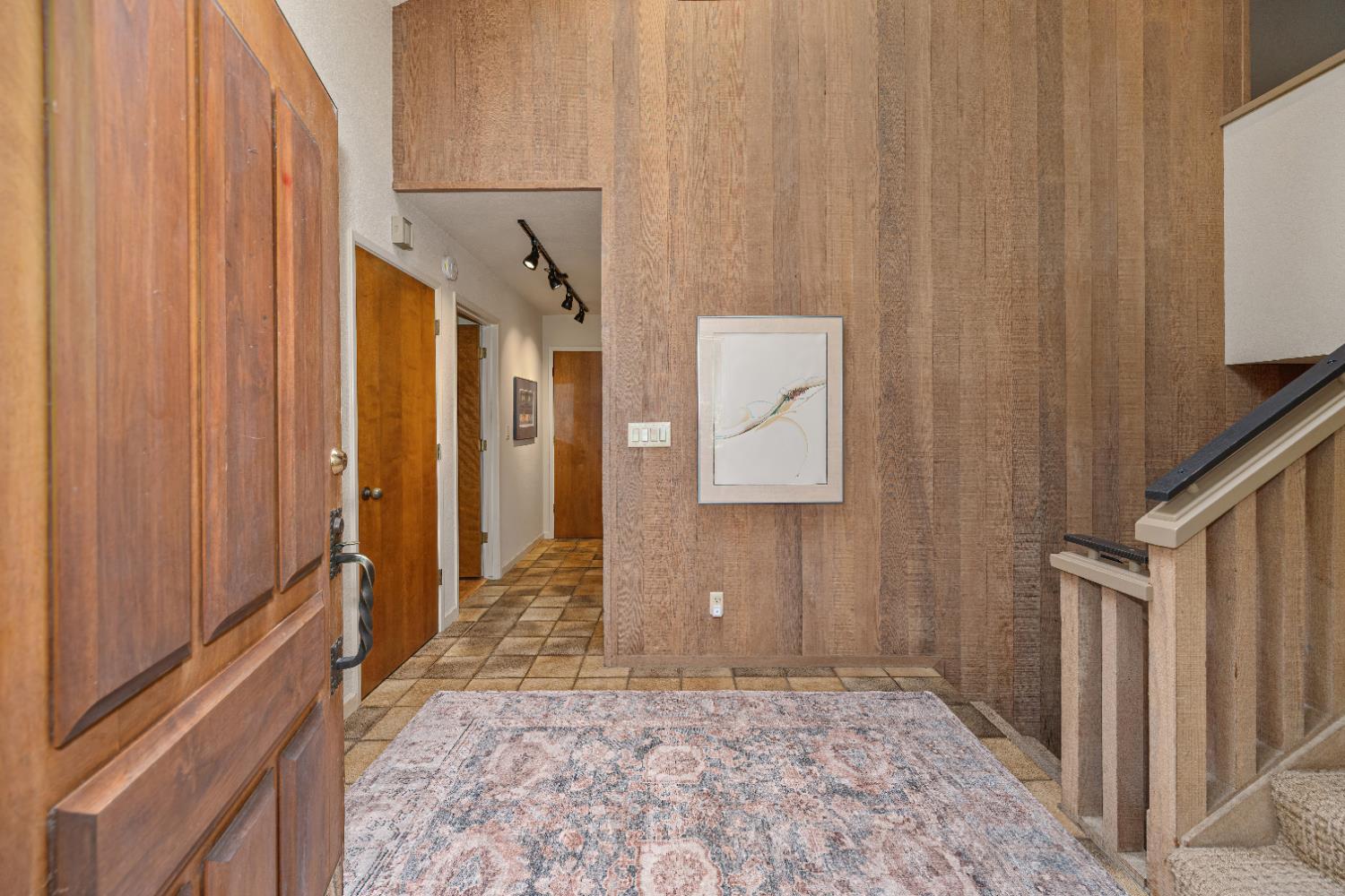 18 Covered Bridge Road Carmichael, CA 95608 - Photo 51 of 81 a view of a hallway with wooden cabinets and staircase