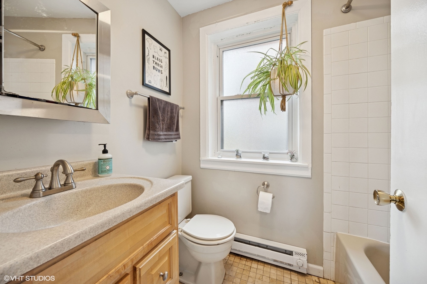 938 Washington Boulevard, Unit 3W Oak Park, IL 60302 - Photo 9 of 16 a bathroom with a sink a toilet and a window