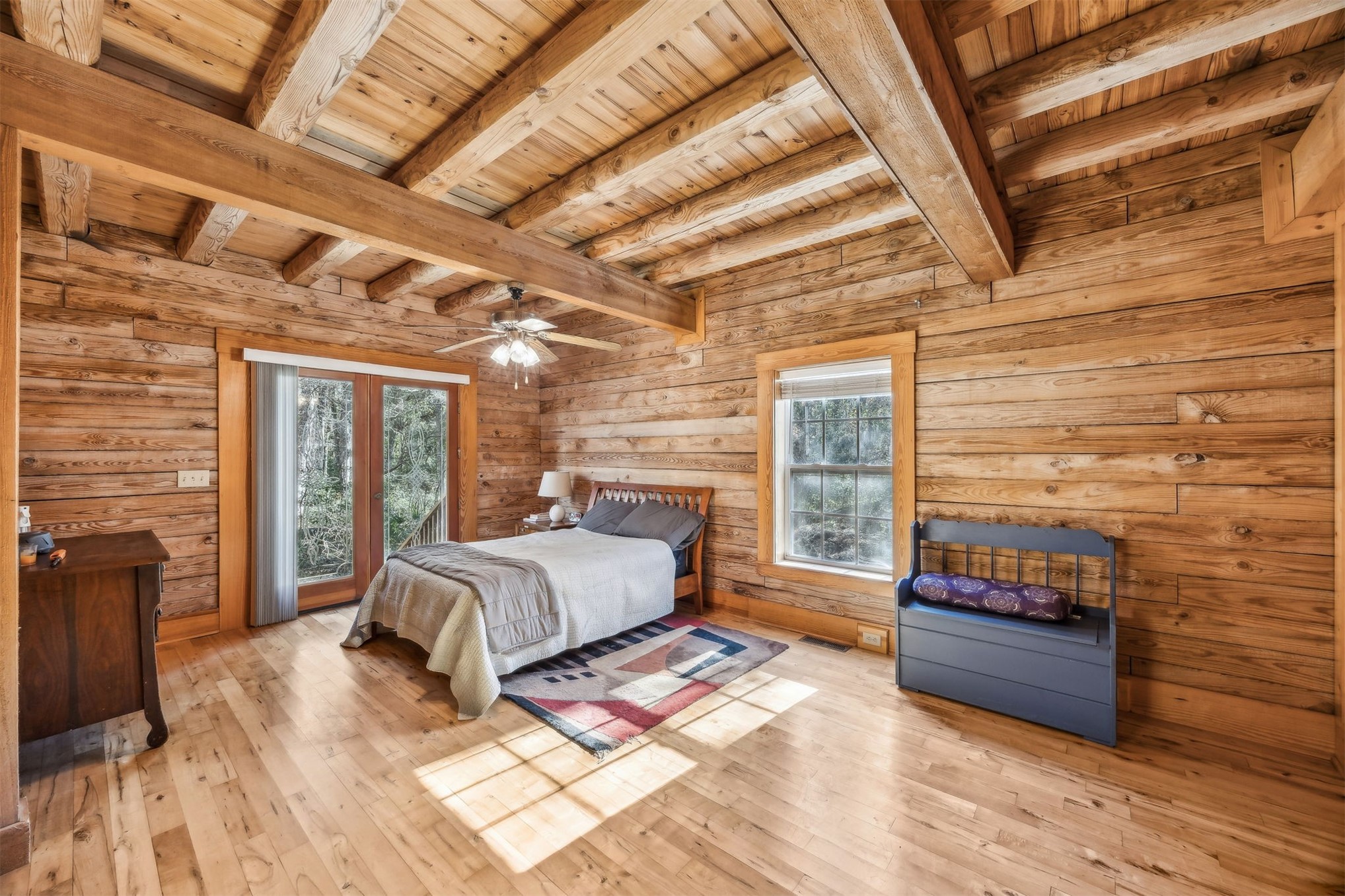 86205 Pages Dairy Road Yulee, FL 32097 - Photo 20 of 56 a spacious bedroom with a bed and wooden floor