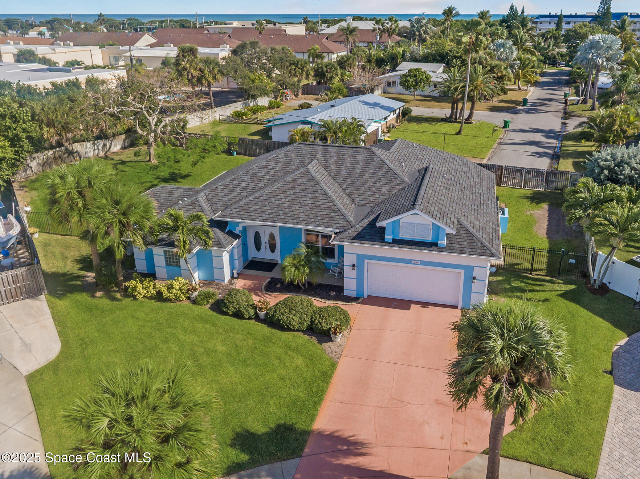 452 Veracruz Boulevard Indialantic, FL 32903 - Photo 1 of 42 an aerial view of a house with garden space and lake view