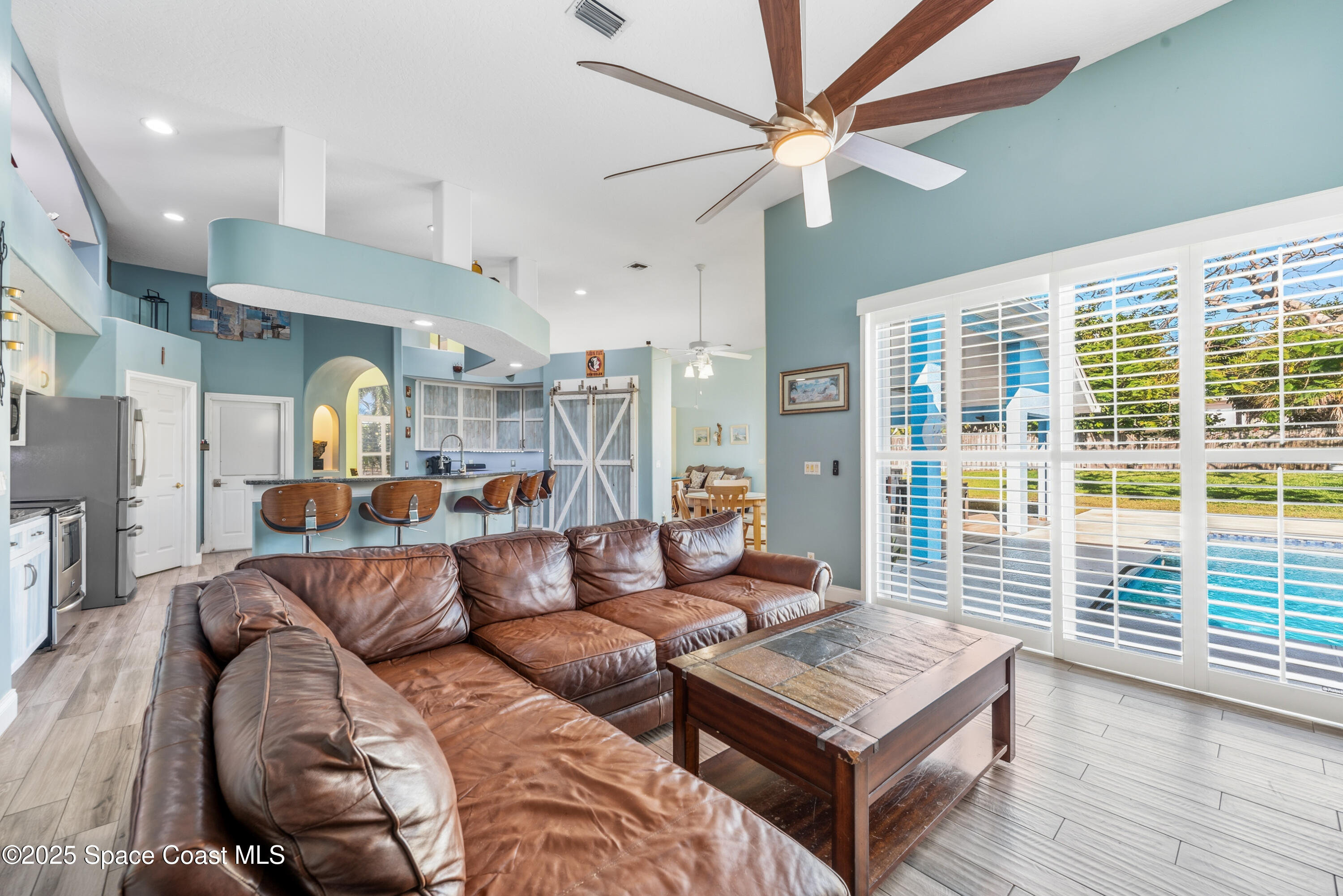 452 Veracruz Boulevard Indialantic, FL 32903 - Photo 15 of 42 a living room with furniture and a window