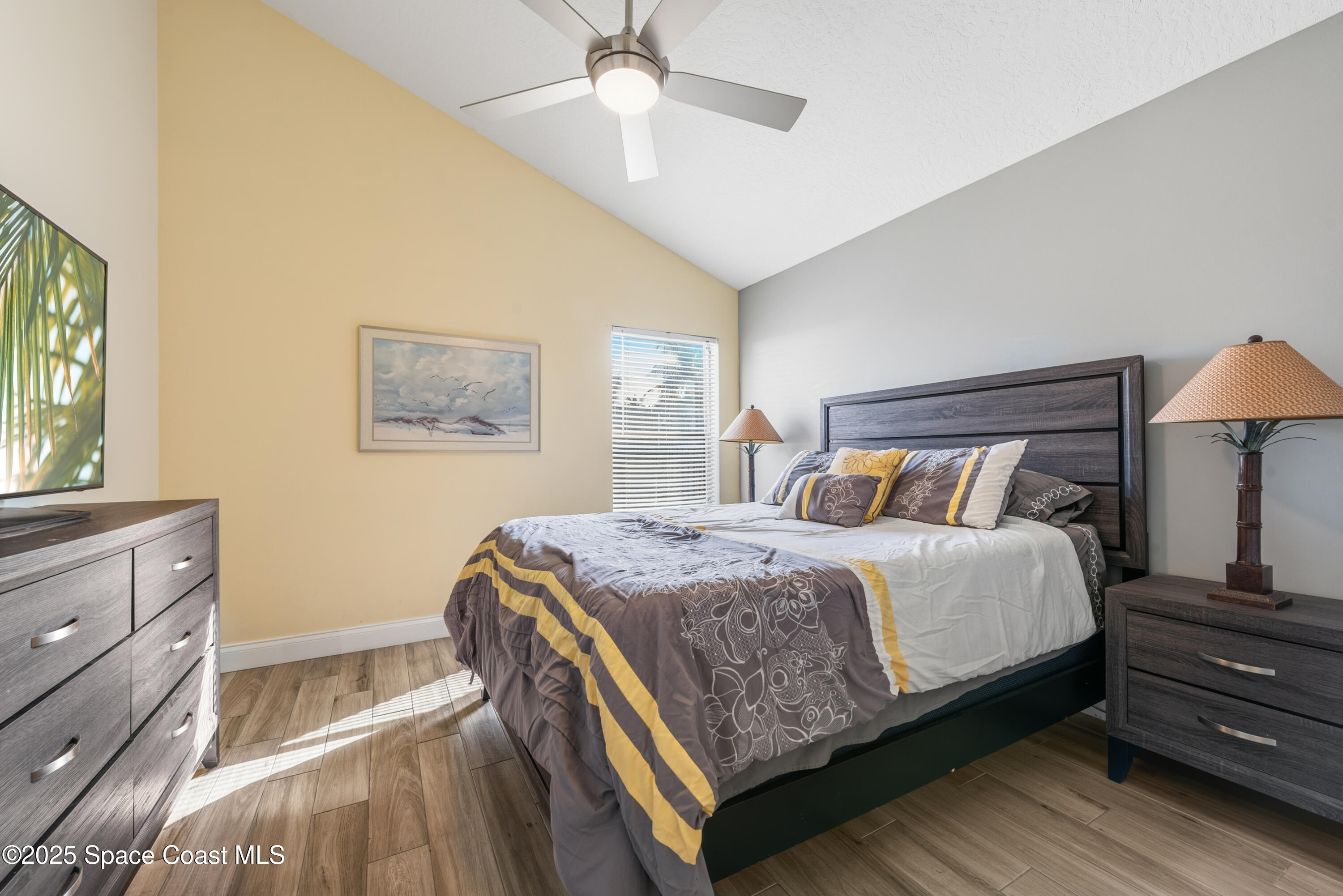 452 Veracruz Boulevard Indialantic, FL 32903 - Photo 21 of 42 a bedroom with a bed and a dresser