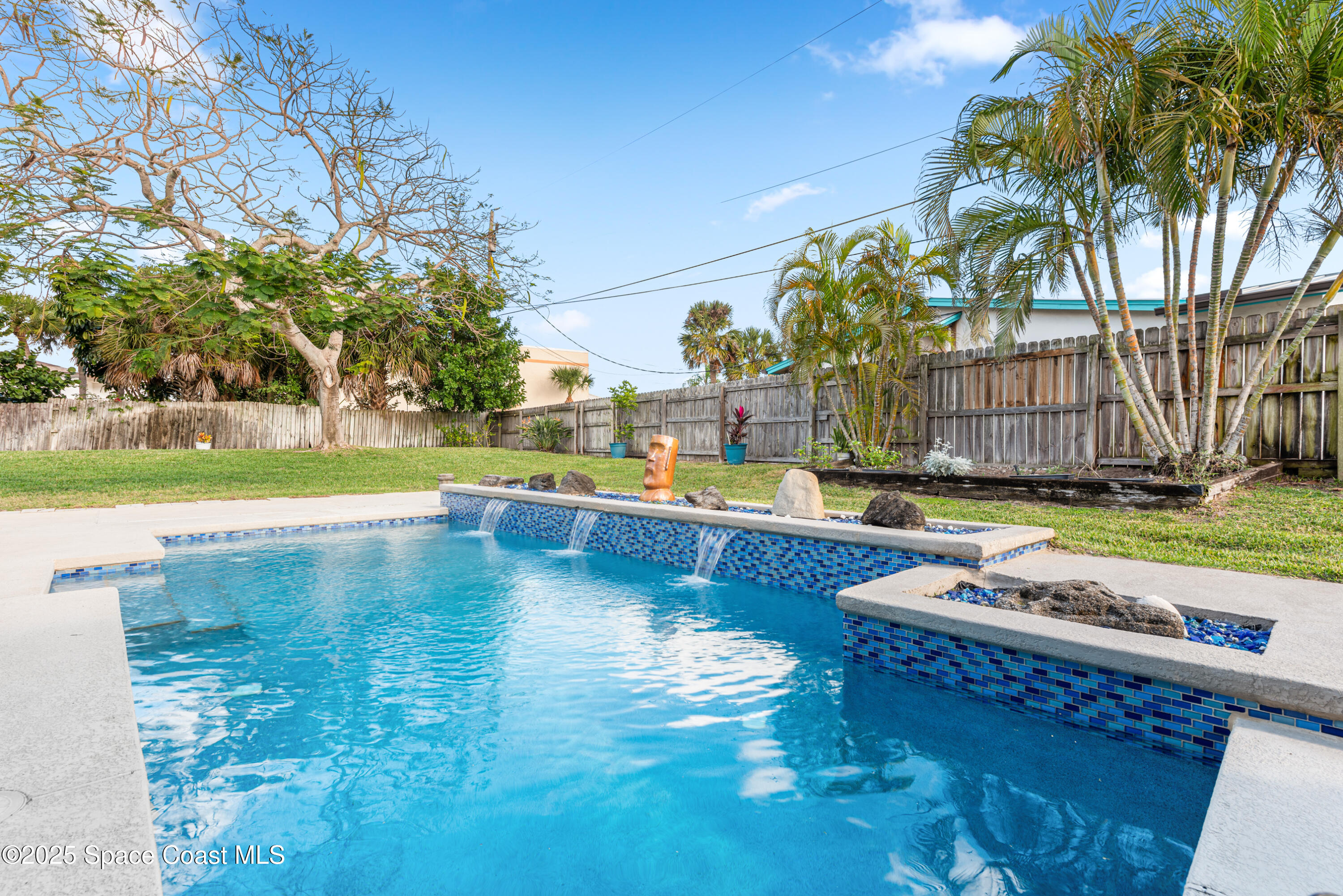 452 Veracruz Boulevard Indialantic, FL 32903 - Photo 26 of 42 a view of a swimming pool with a lounge chairs