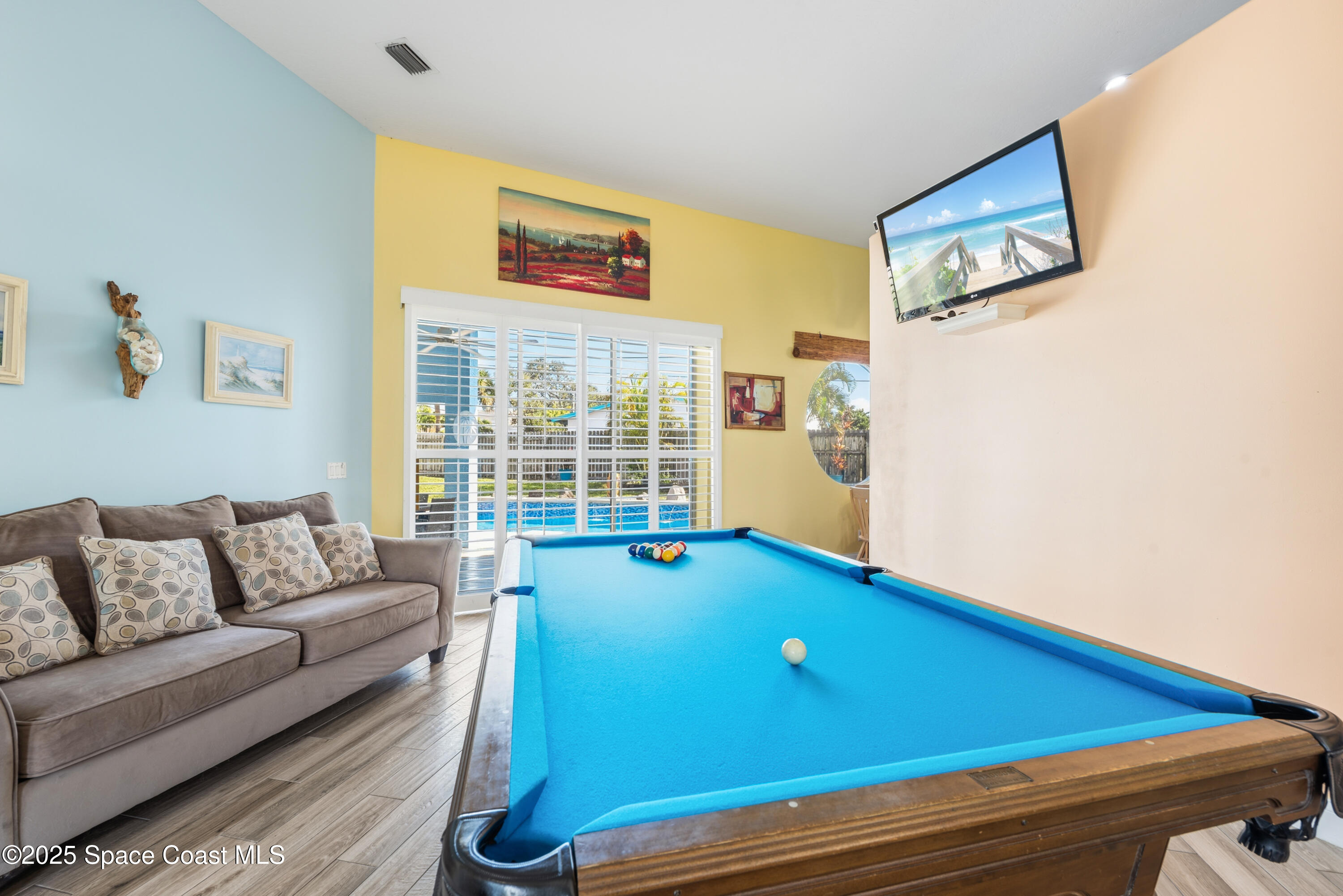 452 Veracruz Boulevard Indialantic, FL 32903 - Photo 33 of 42 a room with furniture and a window