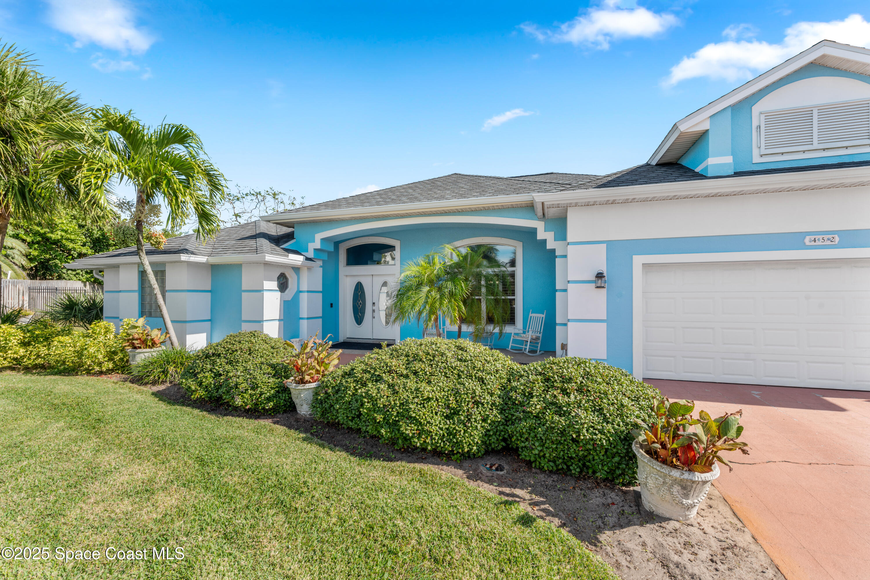 452 Veracruz Boulevard Indialantic, FL 32903 - Photo 37 of 42 a view of a house with a garden