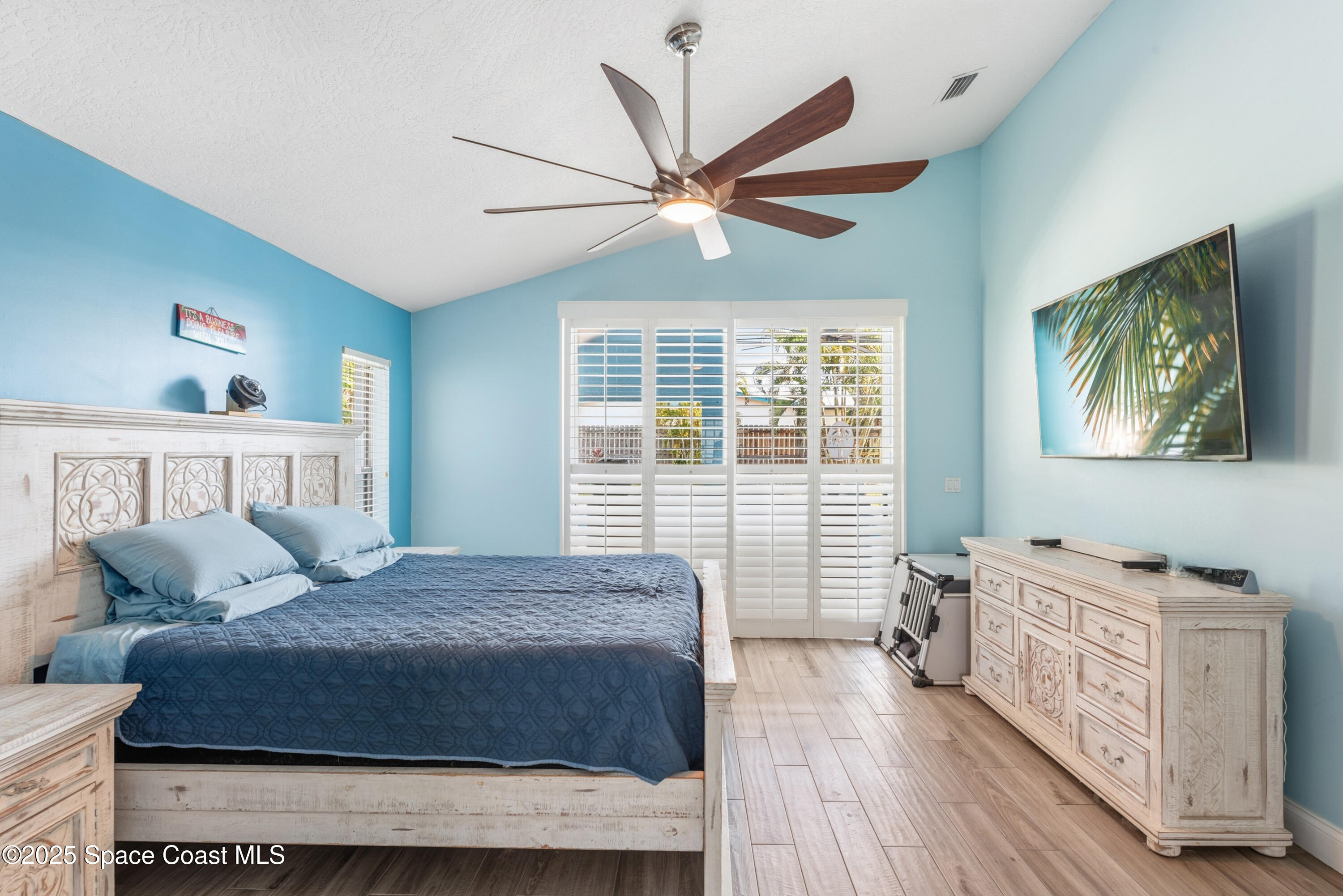 452 Veracruz Boulevard Indialantic, FL 32903 - Photo 4 of 42 a bedroom with a bed and a window