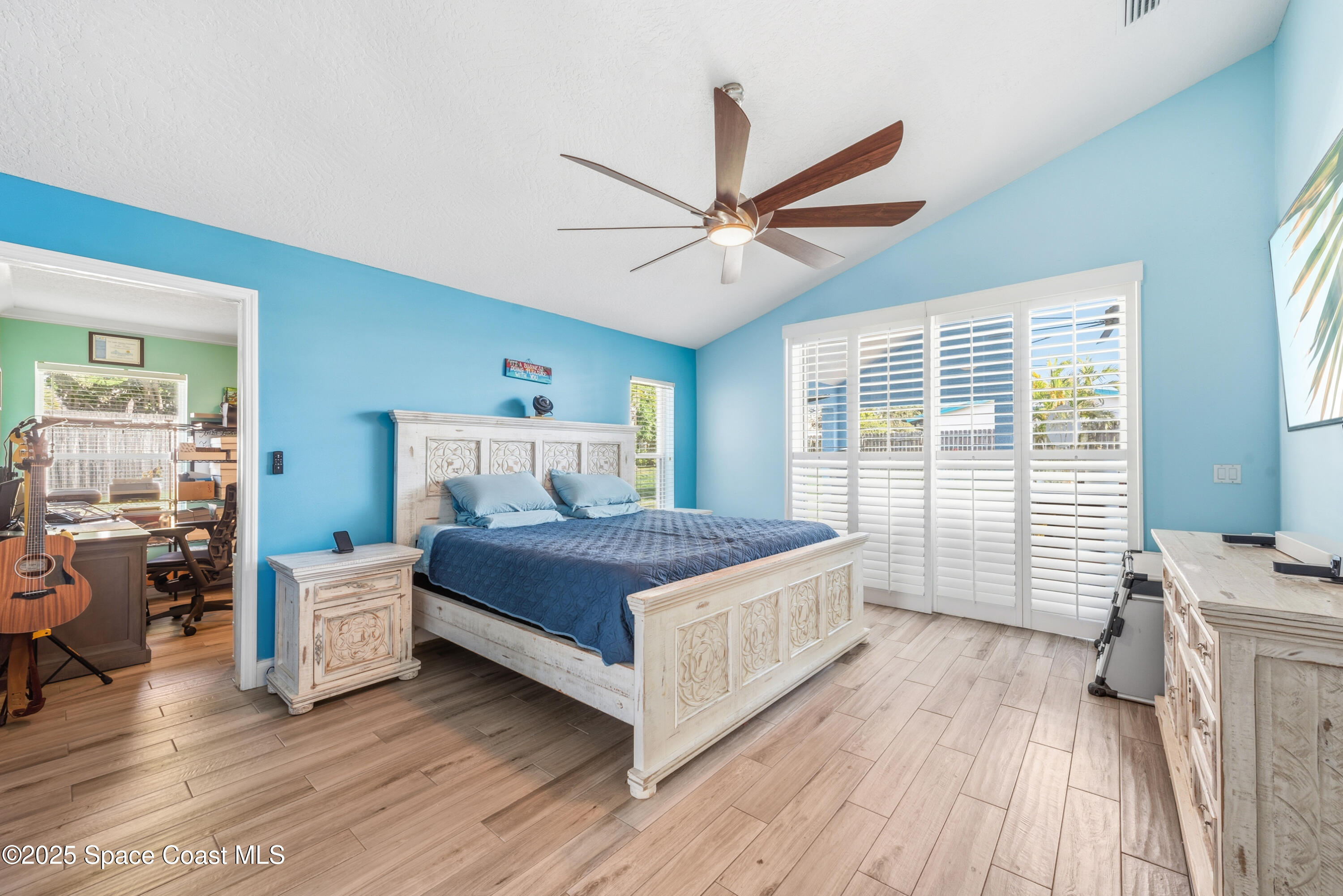 452 Veracruz Boulevard Indialantic, FL 32903 - Photo 5 of 42 a bedroom with a large bed and a window