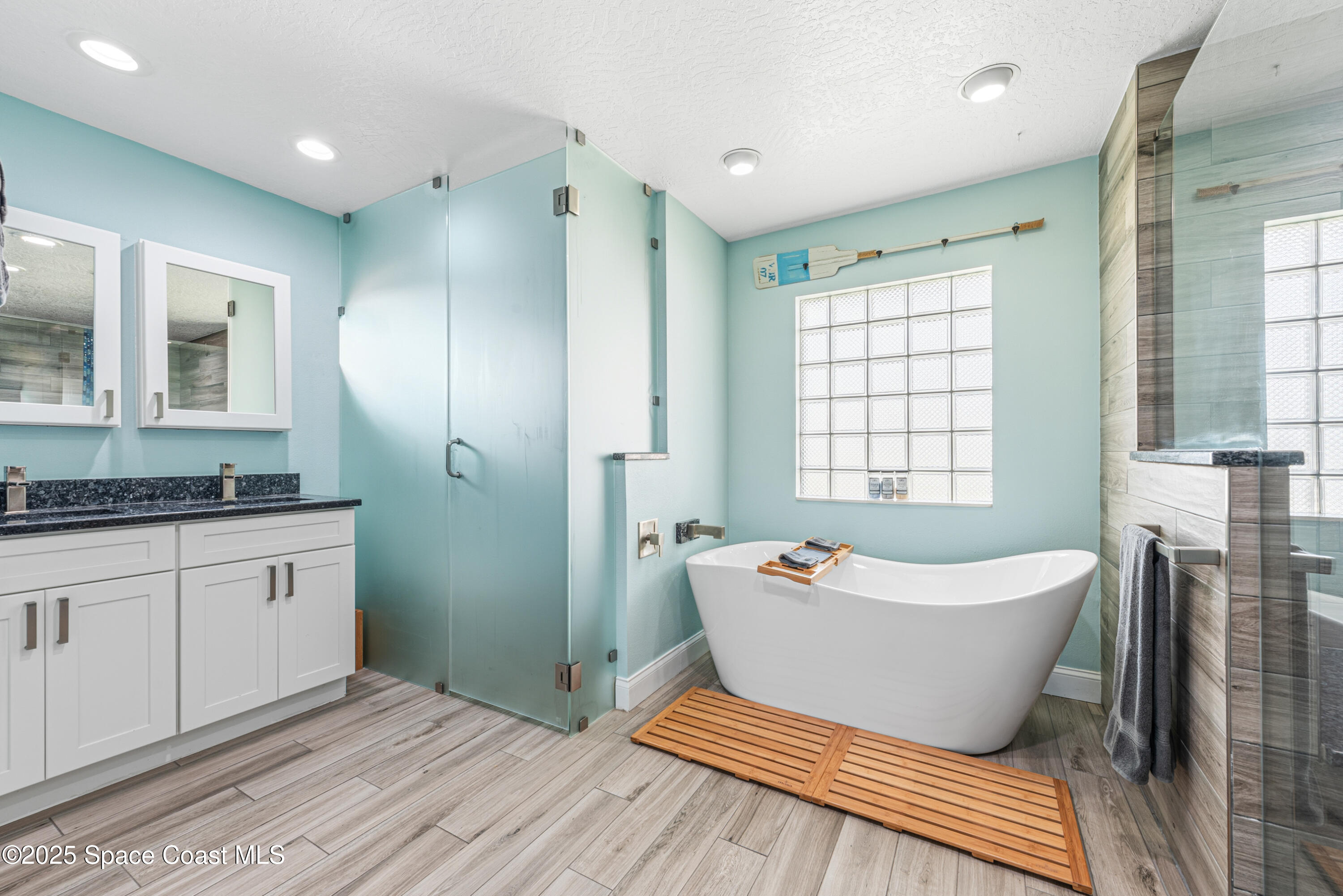 452 Veracruz Boulevard Indialantic, FL 32903 - Photo 7 of 42 a bathroom with a bathtub sink and window
