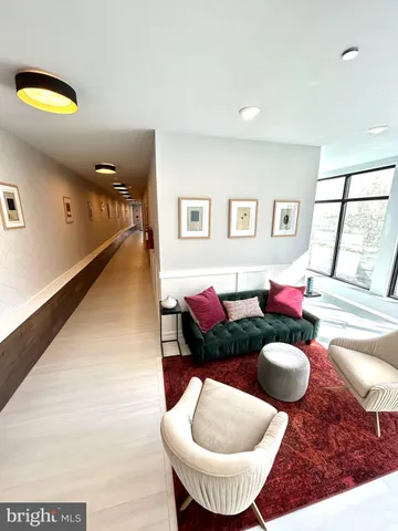 a living room with furniture and a rug