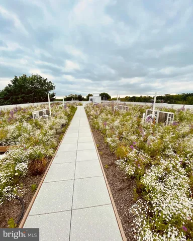 a view of swimming pool with outdoor seating