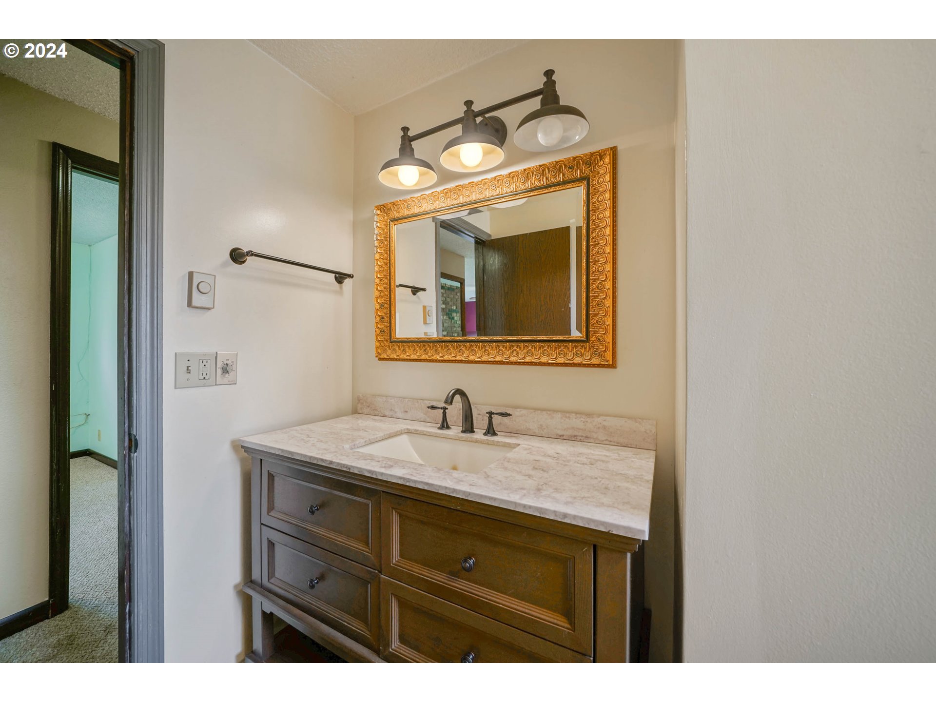 28241 South Barlow Road Aurora, OR 97002 - Photo 13 of 28 a bathroom with a sink and a mirror