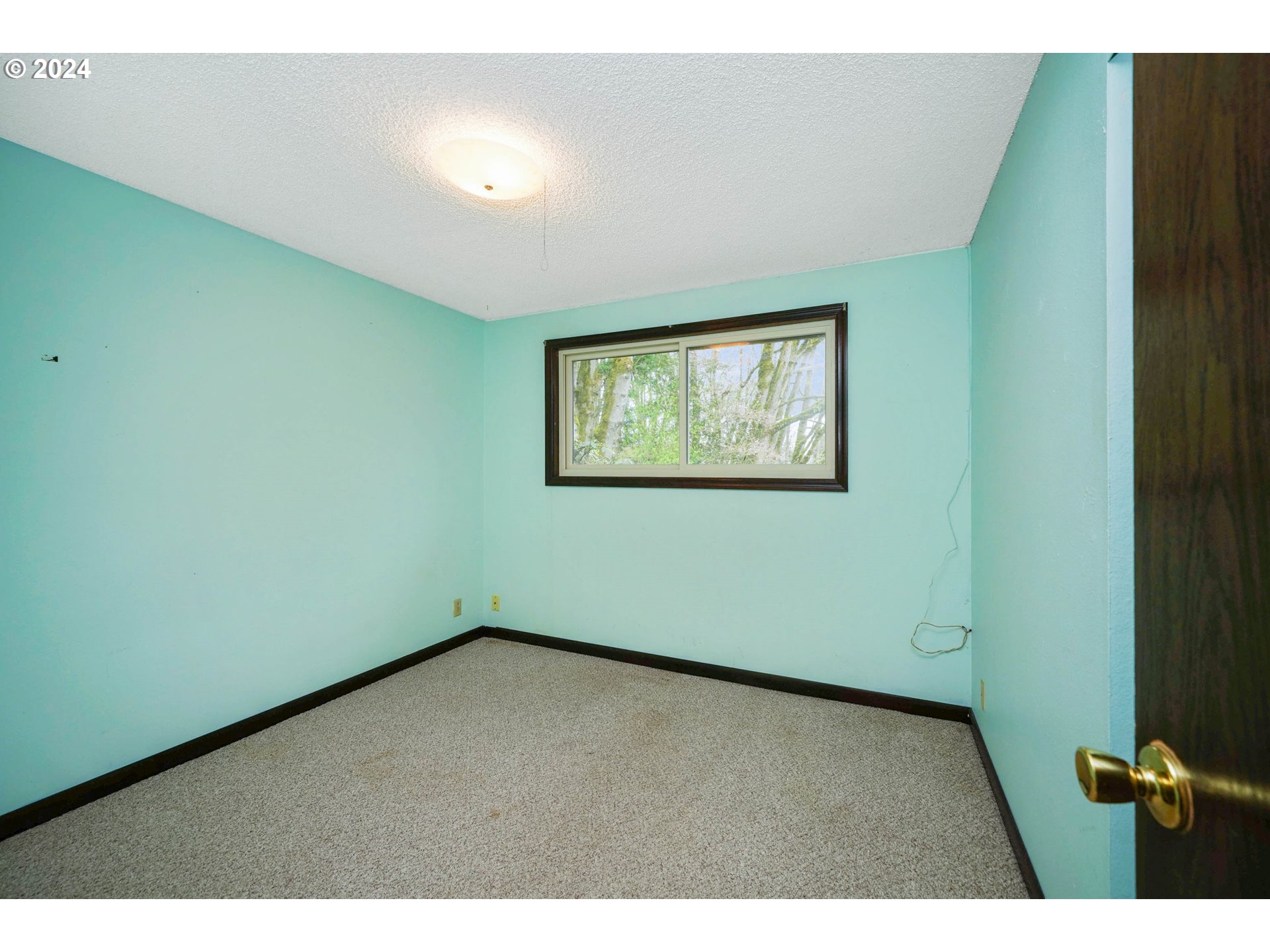 28241 South Barlow Road Aurora, OR 97002 - Photo 6 of 28 a view of an empty room with windows