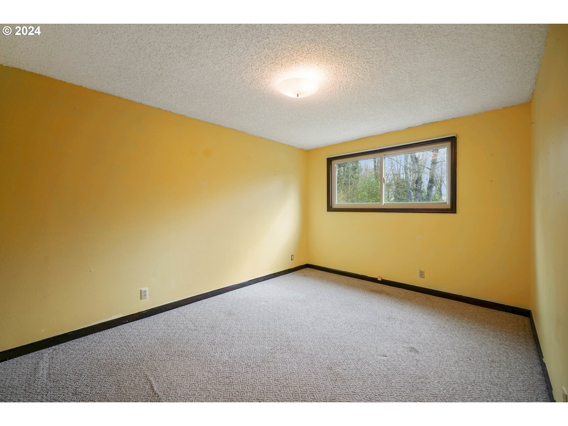 28241 South Barlow Road Aurora, OR 97002 - Photo 8 of 28 a view of an empty room with a window