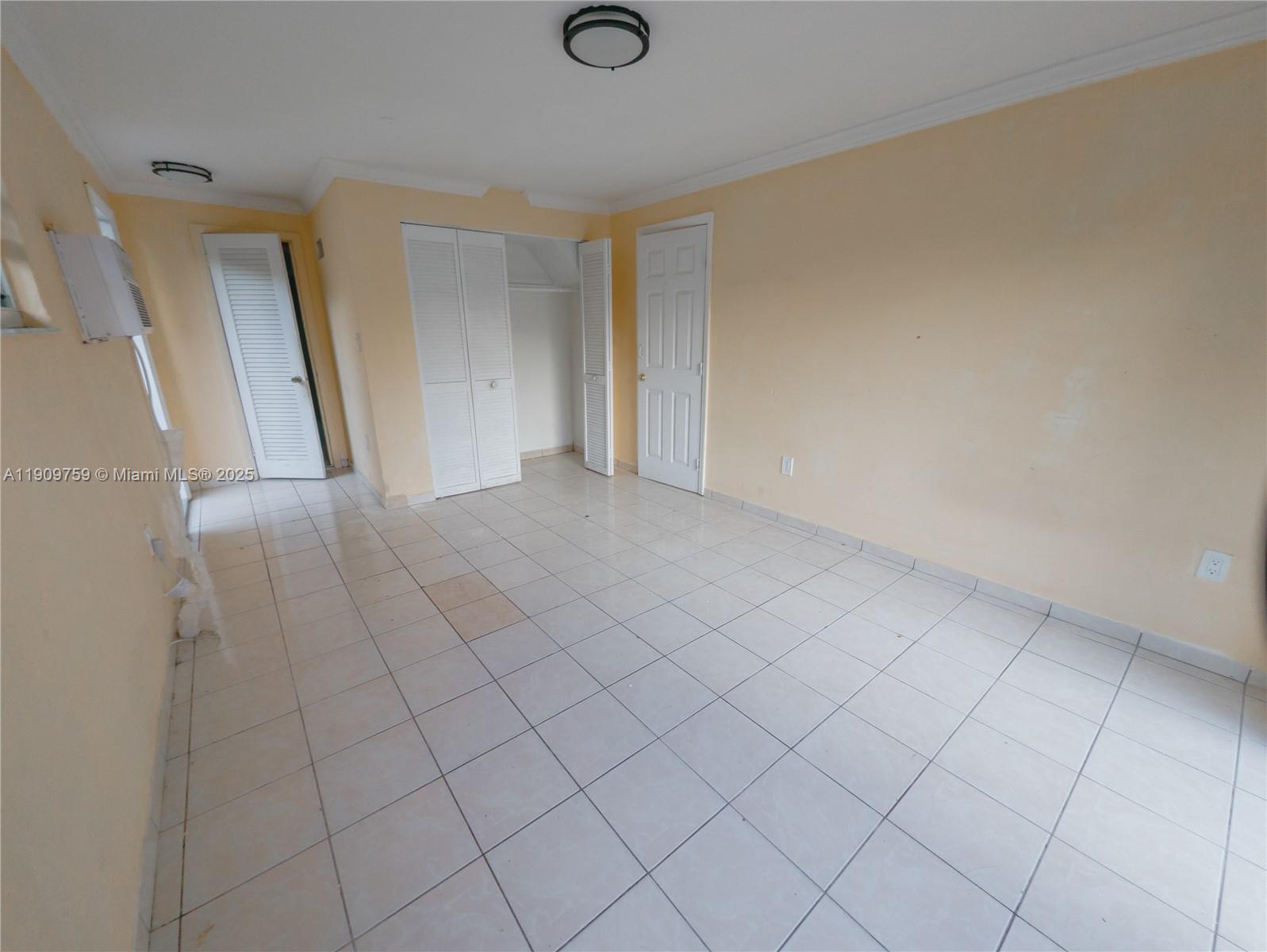 2575 Southwest 59th Avenue, Unit 2575 Miami, FL 33155 - Photo 11 of 21 a view of an empty room and wooden floor